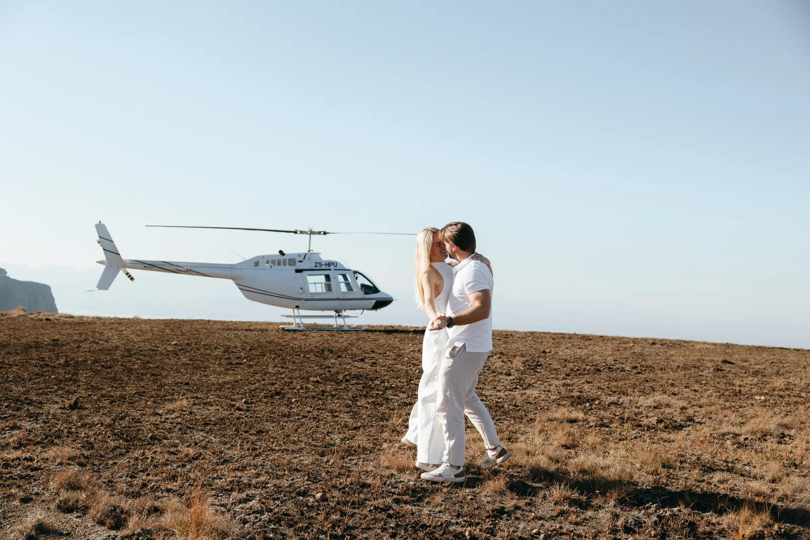 The two of them together beside the helicopter